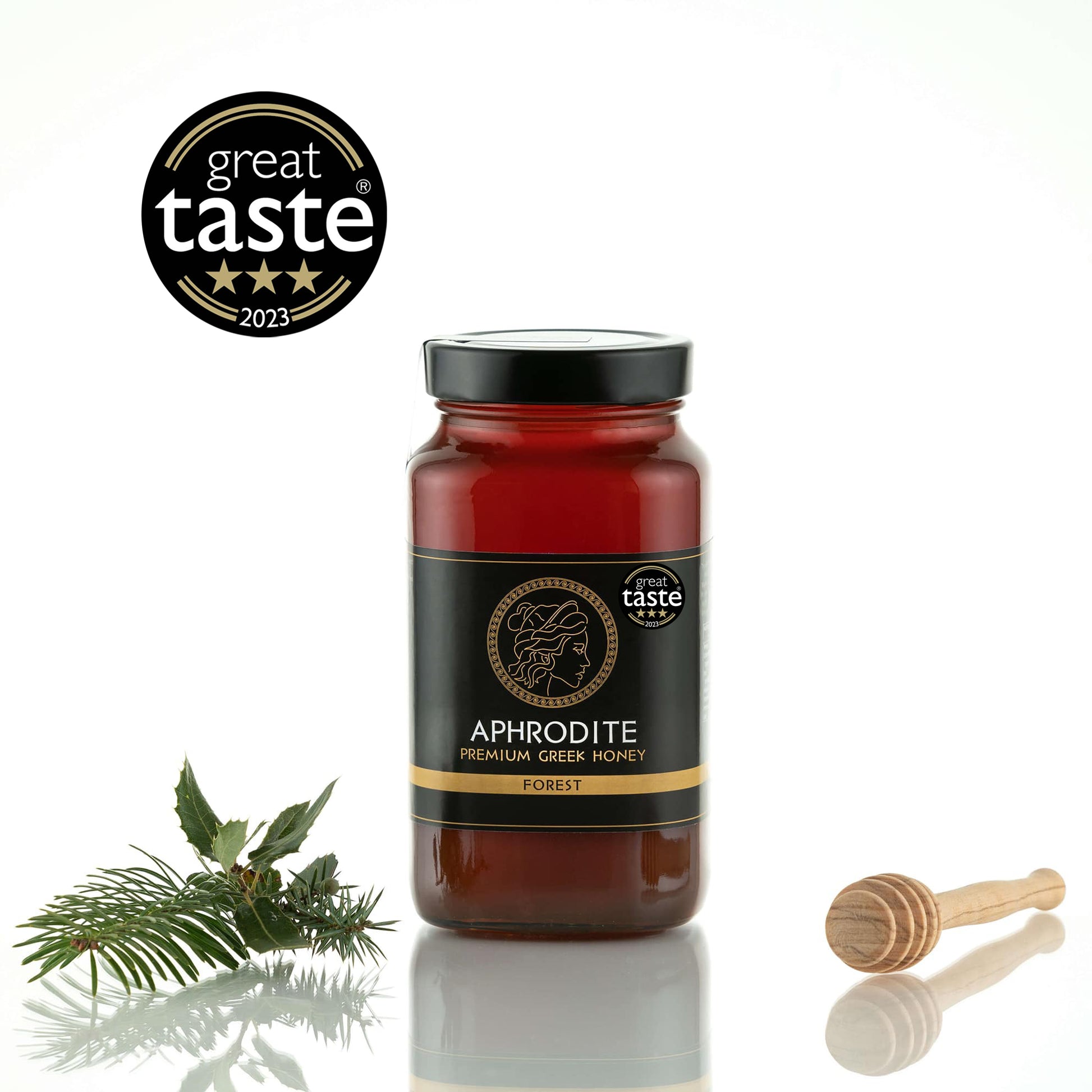 Greek Raw Forest Honey in a 950g glass jar in white background. Jar presented from the front . 100% Pure Honey. Aphrodite Honey. Aphrodite Premium Greek Honey.