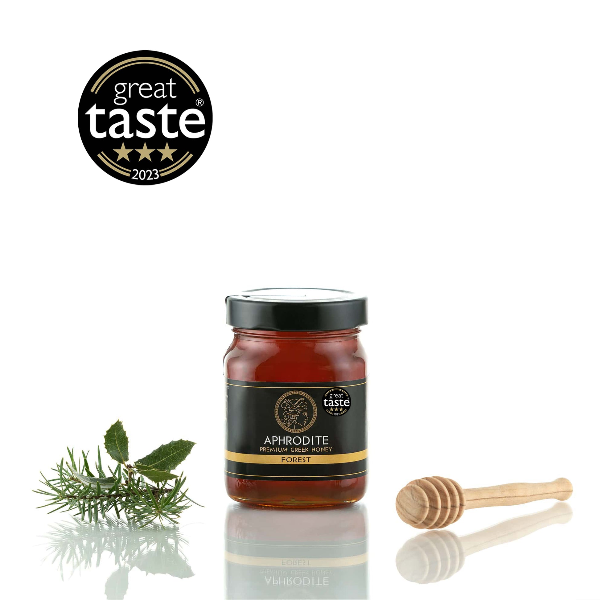 Greek Raw Forest Honey in a 500g glass jar in white background. Jar presented from the front . 100% Pure Honey. Aphrodite Honey. Aphrodite Premium Greek Honey.