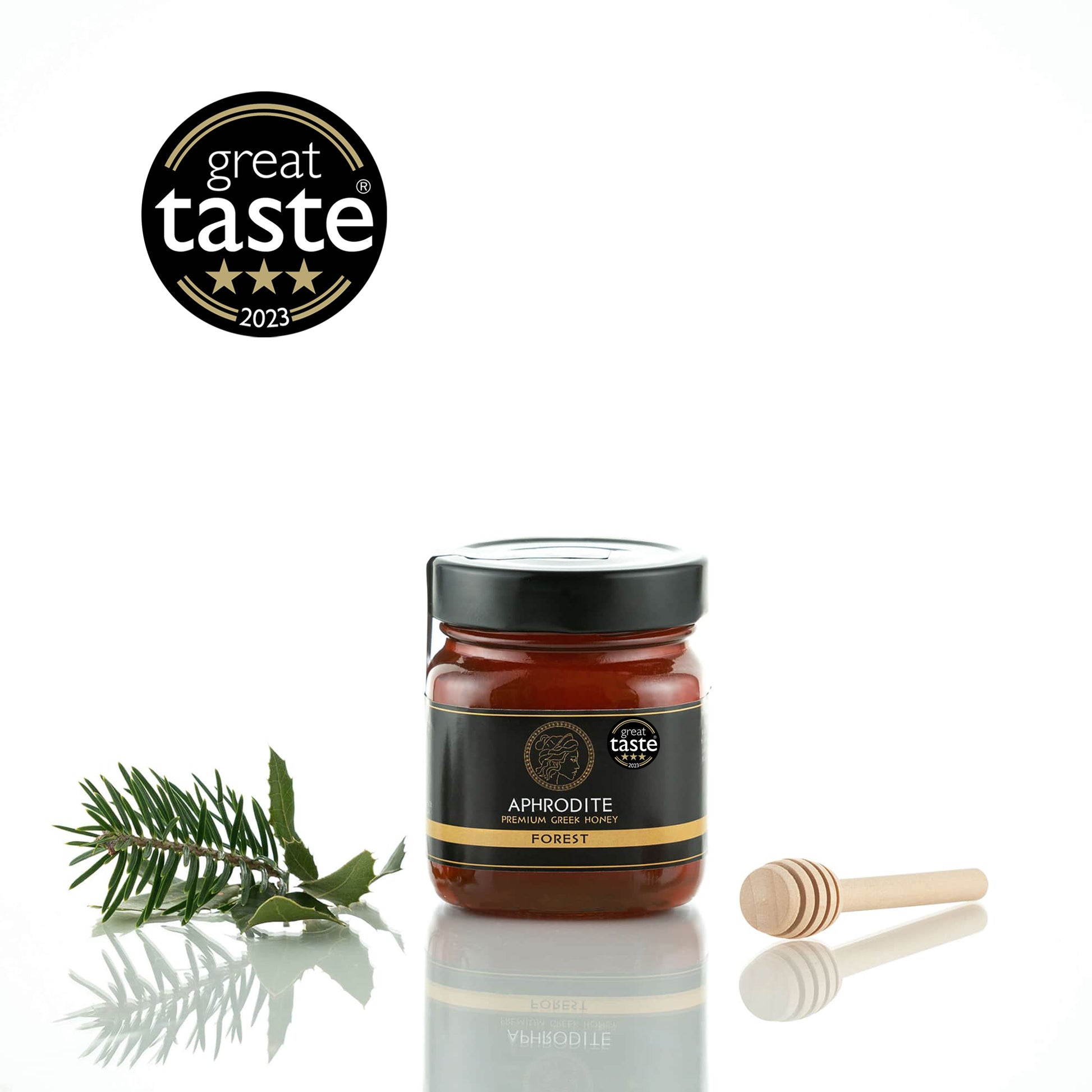 Greek Raw Forest Honey in a 250g glass jar in white background. Jar presented from the front . 100% Pure Honey. Aphrodite Honey. Aphrodite Premium Greek Honey.