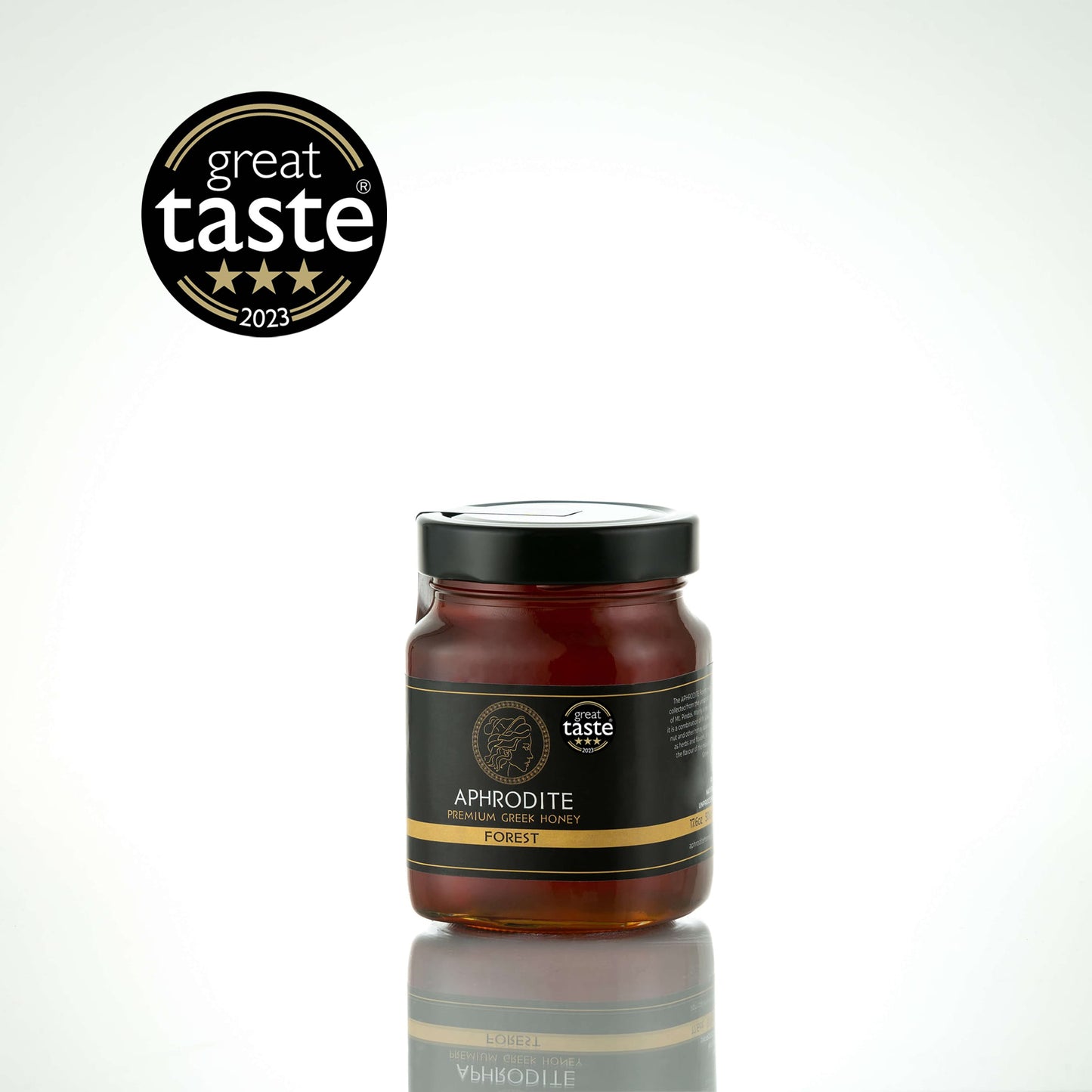Greek Raw Forest Honey in a 500g glass jar in white background. Jar presented on the side. 100% Pure Honey. Aphrodite Honey. Aphrodite Premium Greek Honey.