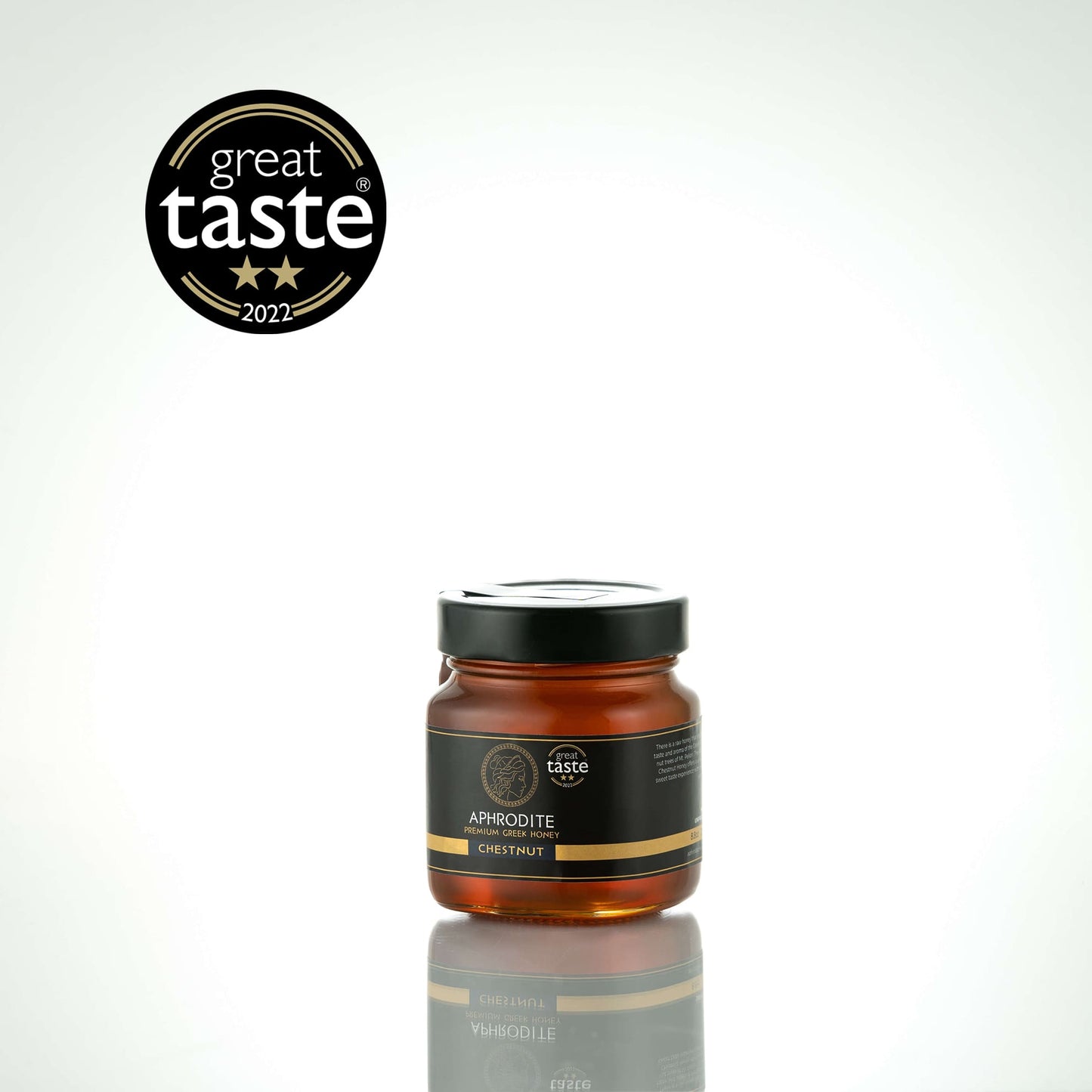 Greek Raw Chestnut Honey in a 250g glass jar in white background. Jar presented on the side. 100% Pure Honey. Aphrodite Honey. Aphrodite Premium Greek Honey. Great Taste 2 stars.