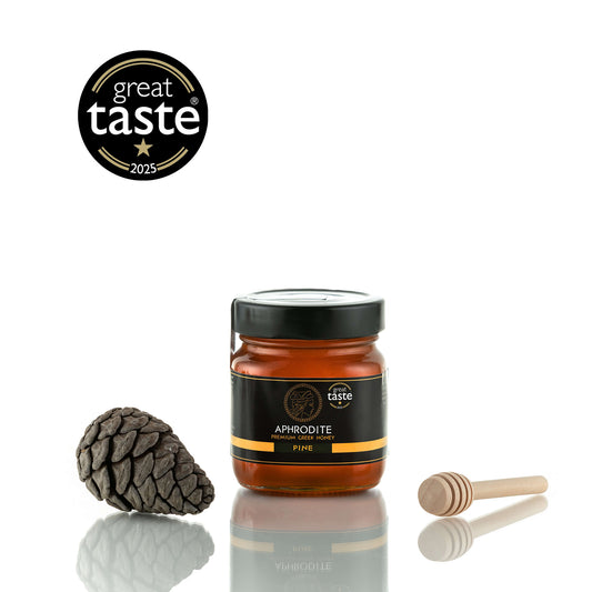 Aphrodite Raw Pine Honey 250g jar with a pinecone and honey dipper, Great Taste 2025 award badge, white background