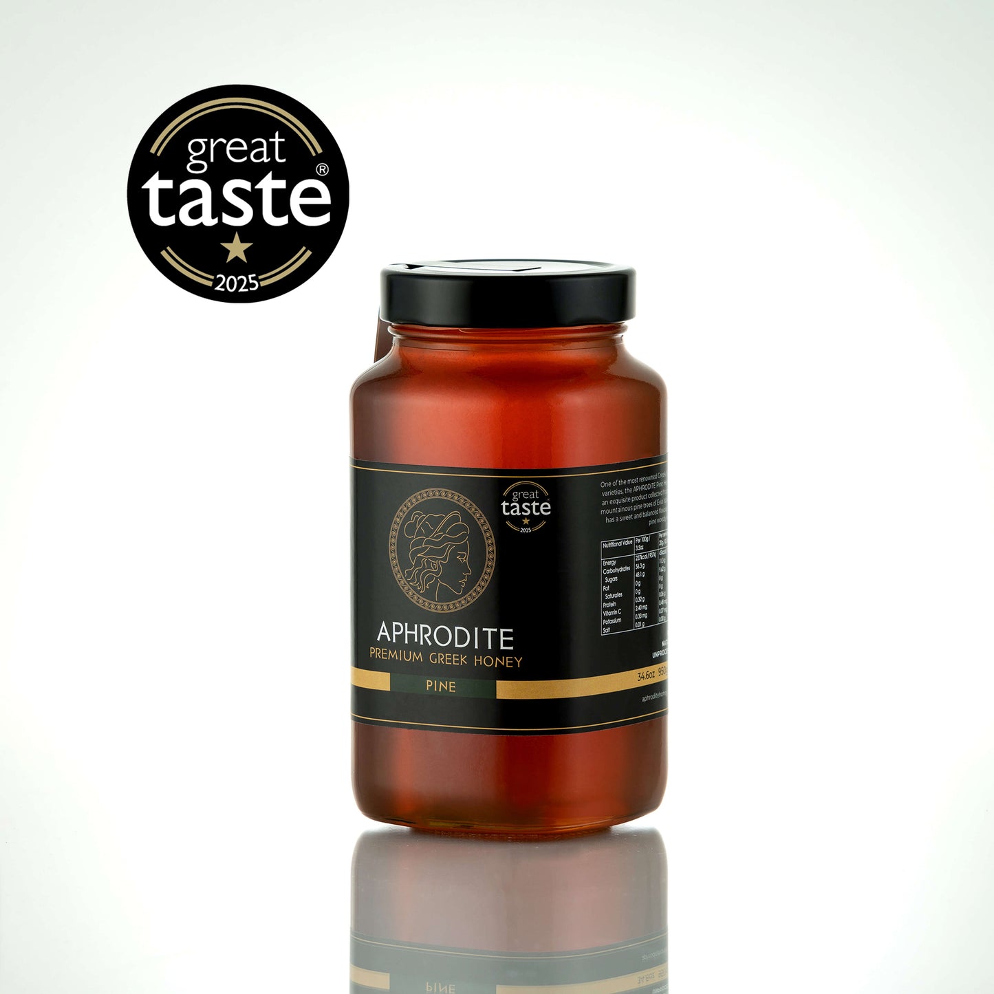 Aphrodite Raw Pine Honey 950g large glass jar with black lid on a white reflective background, Great Taste 2025 award badge