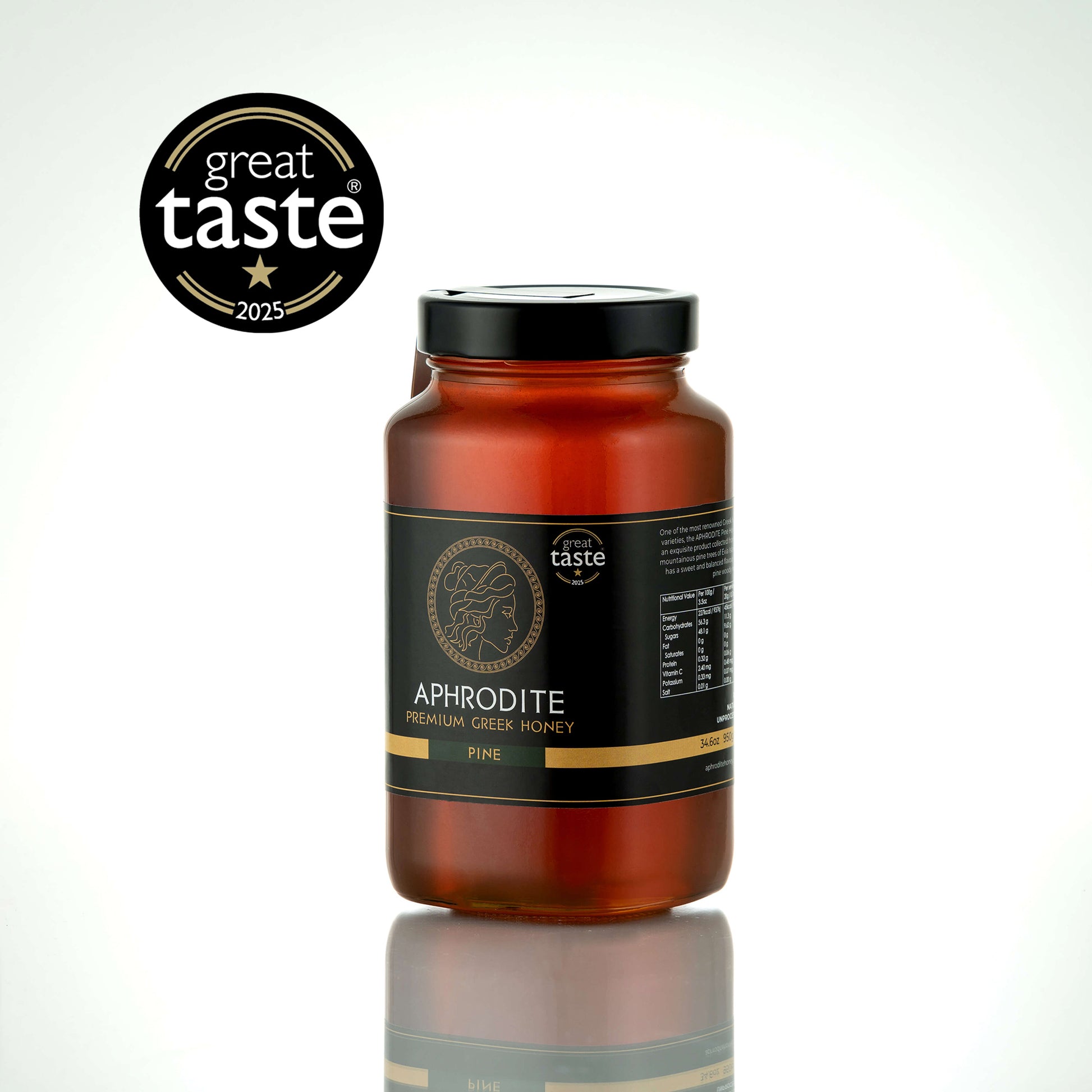 Aphrodite Raw Pine Honey 950g large glass jar with black lid on a white reflective background, Great Taste 2025 award badge