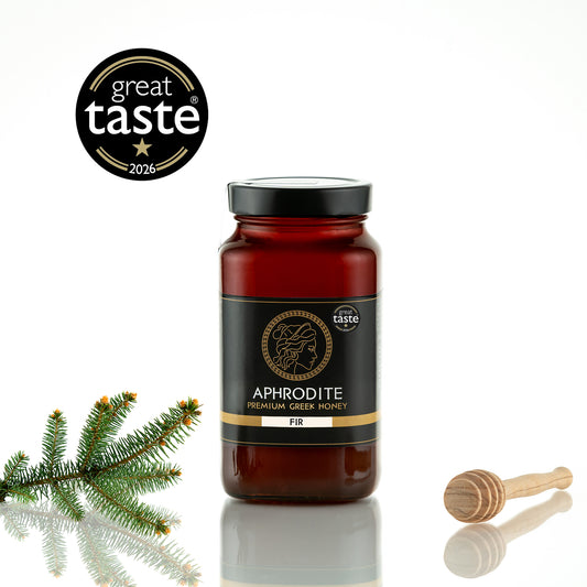 Aphrodite Raw Fir Honey 950g jar with fir sprig and wooden honey dipper, 2026 Great Taste award badge