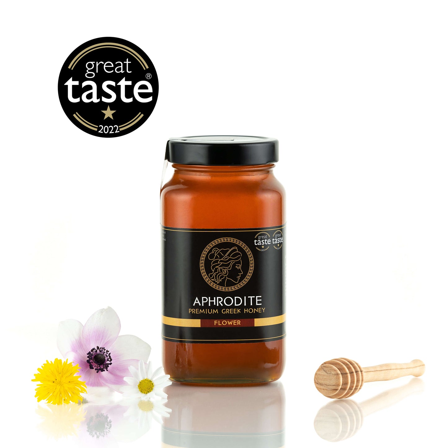 Aphrodite Raw Flower Honey 950g jar with wildflowers and a honey dipper, Great Taste 2022 award badge, white background