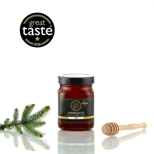 Aphrodite Raw Fir Honey 480g jar with fir sprig and wooden honey dipper, 2026 Great Taste award badge