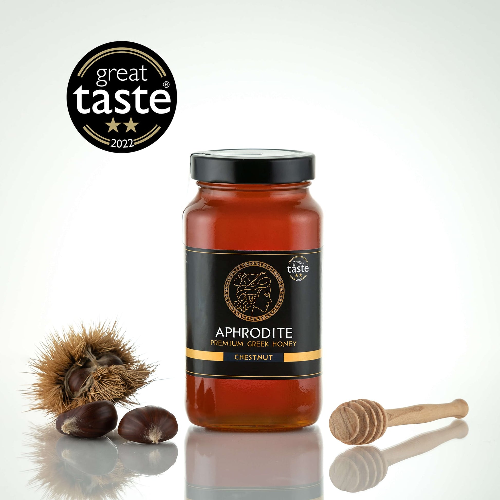 Greek Raw Chestnut Honey in a 950g glass jar in white background. Jar presented from the front. 100% Pure Honey. Aphrodite Honey. Aphrodite Premium Greek Honey. Great Taste 2 stars.