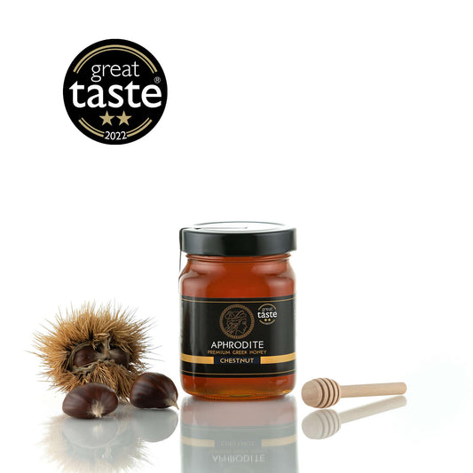 Greek Raw Chestnut Honey in a 500g glass jar in white background. Jar presented from the front. 100% Pure Honey. Aphrodite Honey. Aphrodite Premium Greek Honey. Great Taste 2 stars.